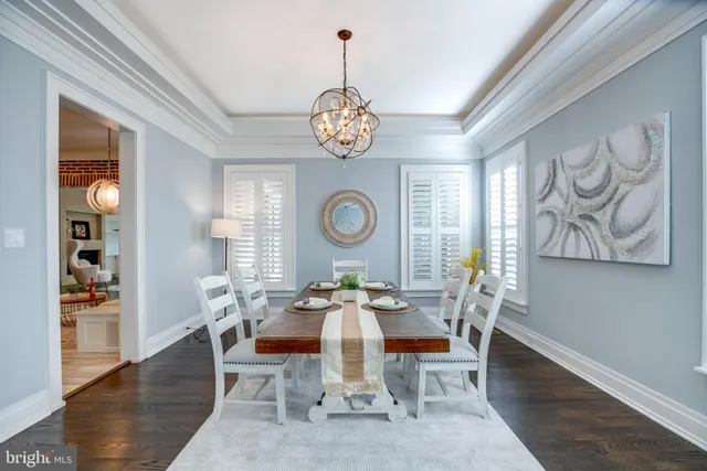 a kitchen with stainless steel appliances granite countertop wooden floor a stove a sink and a refrigerator