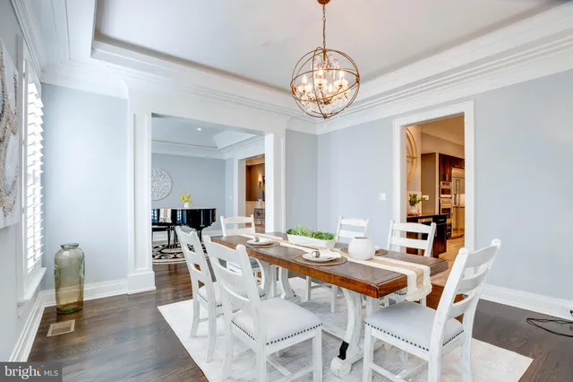 a kitchen with granite countertop a sink a stove and cabinets