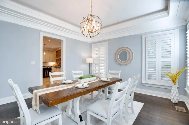 a kitchen with a stove sink and living room