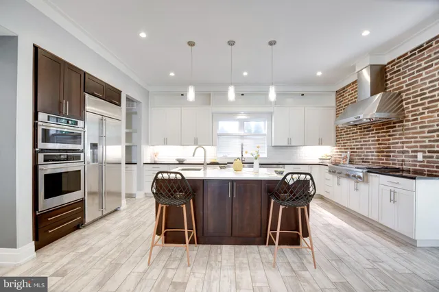 an empty room with floor to ceiling window and wooden floor