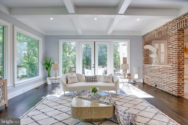 a view of a livingroom with furniture and a window