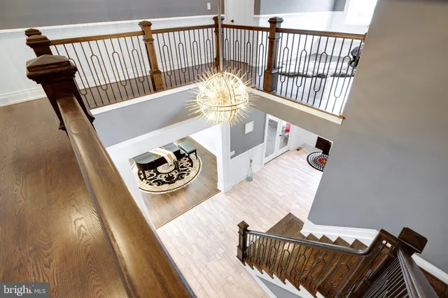 a living room with furniture a wooden floor and a window