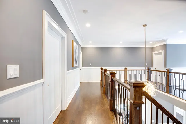 a view of a living room and kitchen with furniture wooden floor and windows