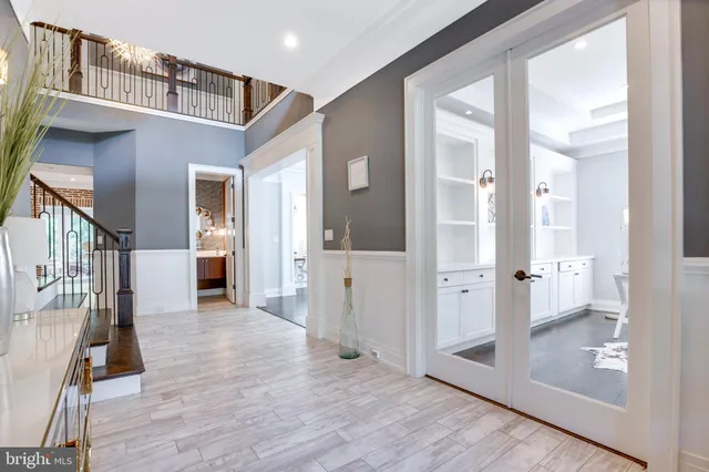 a workspace with wooden floor and a window