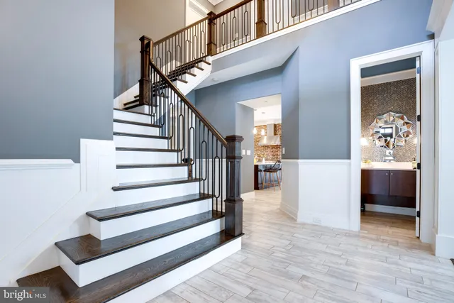 a view of a dining room with furniture wooden floor and chandelier
