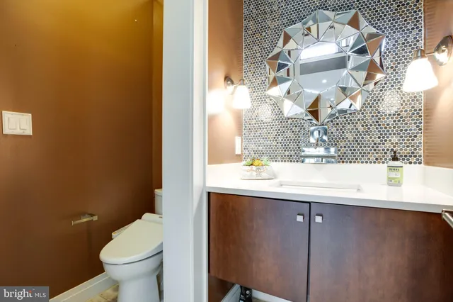a living room with kitchen island furniture and a wooden floor
