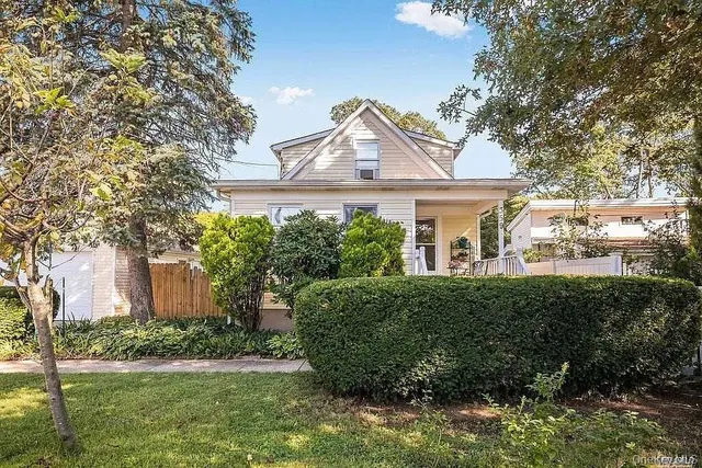 a view of a house with a yard and plants