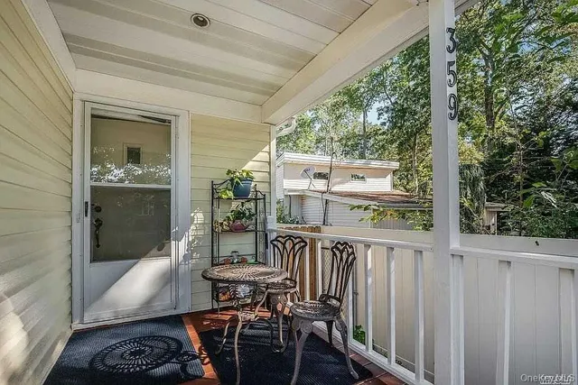 a view of a balcony with furniture