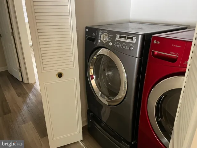 a view of a storage and utility room with washer and dryer