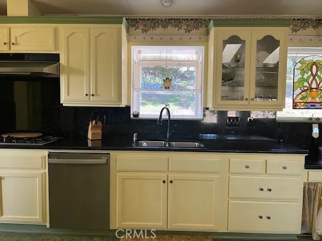a kitchen with stainless steel appliances a cabinets and a counter top space