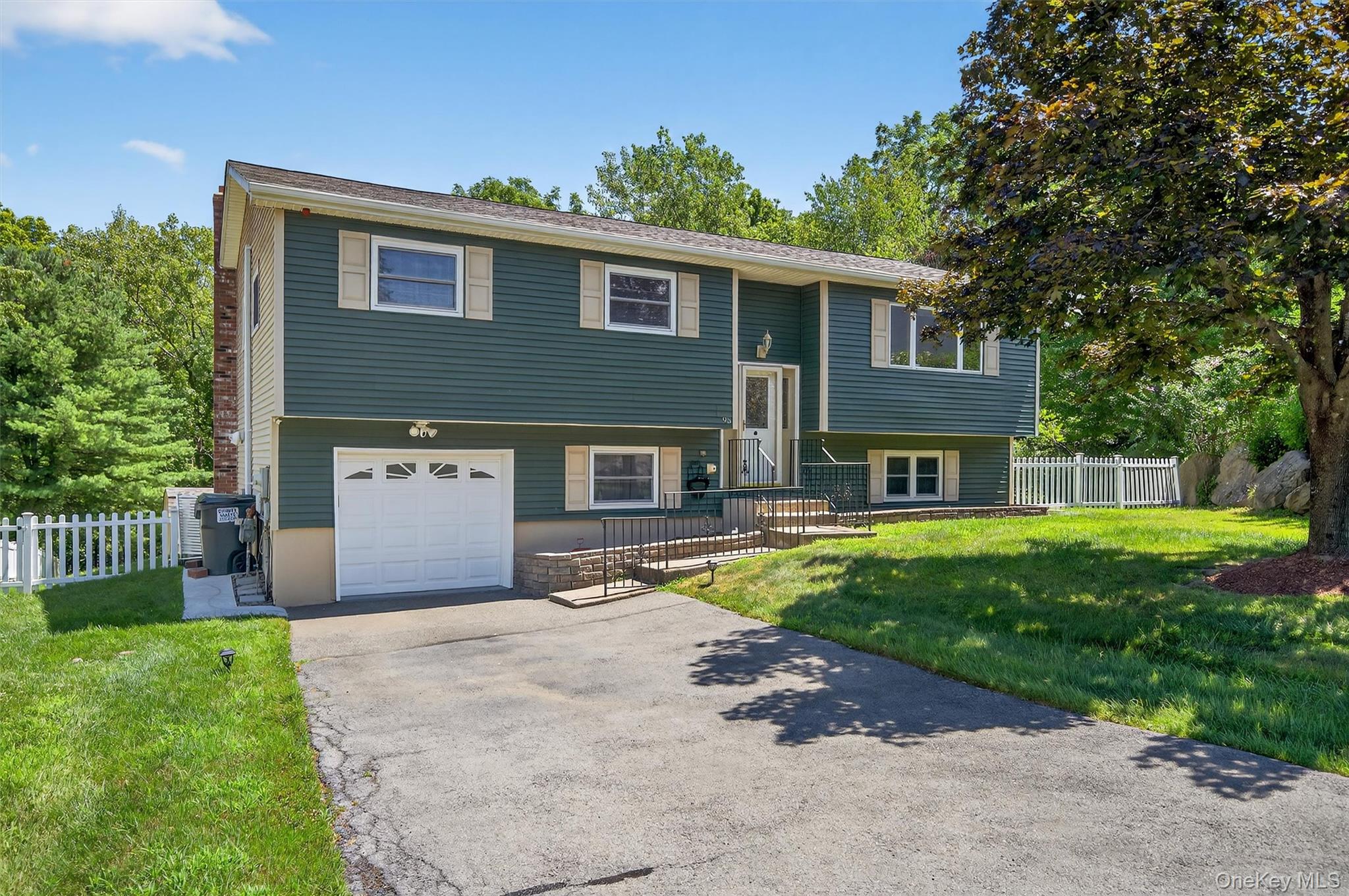 95 Rolling Meadows Road Middletown, NY 10940 - Photo 1 of 1 a front view of a house with a yard and garage