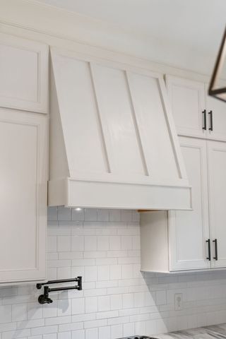 a kitchen with a stove and a sink