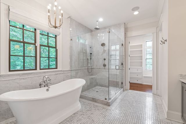 a outdoor space with patio couch and a fireplace