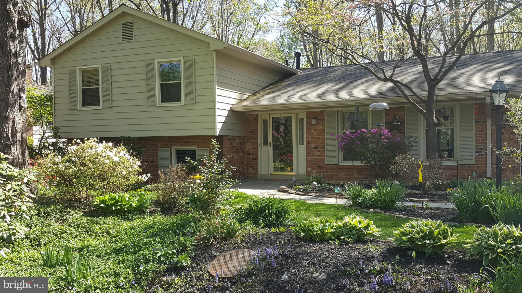 2360 Tumbletree Way Reston, VA 20191 - Photo 4 of 15 front view of a house with a yard