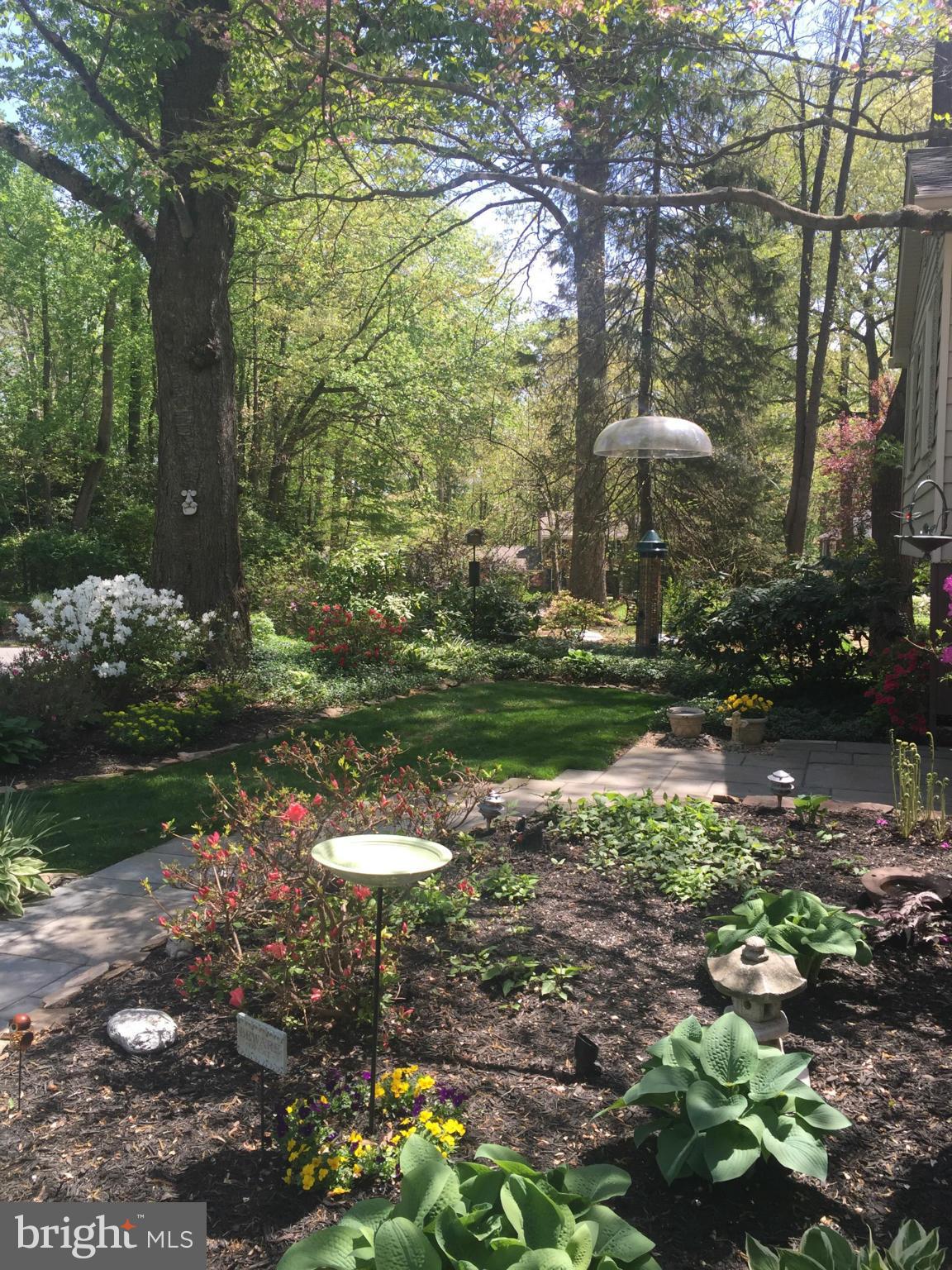 2360 Tumbletree Way Reston, VA 20191 - Photo 8 of 15 a backyard of a house with a yard and outdoor seating