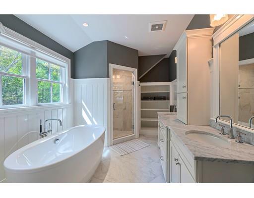 130 Ridge Road Concord, MA 01742 - Photo 14 of 26 a bathroom with a sink double vanity and a tub