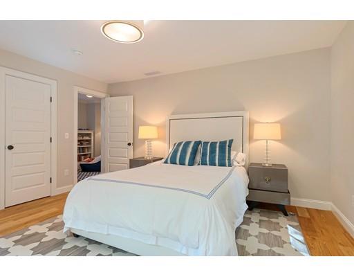 130 Ridge Road Concord, MA 01742 - Photo 15 of 26 a bedroom with a bed and a walk in closet