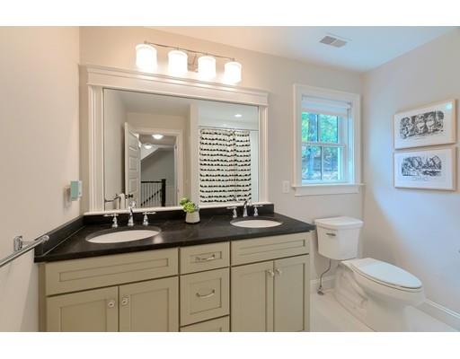130 Ridge Road Concord, MA 01742 - Photo 17 of 26 a bathroom with a granite countertop sink toilet a large mirror and a window