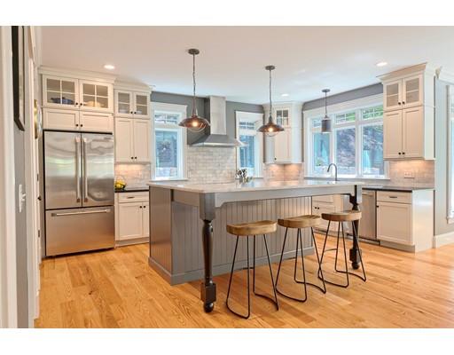 130 Ridge Road Concord, MA 01742 - Photo 2 of 26 a kitchen with stainless steel appliances kitchen island granite countertop a sink and cabinets