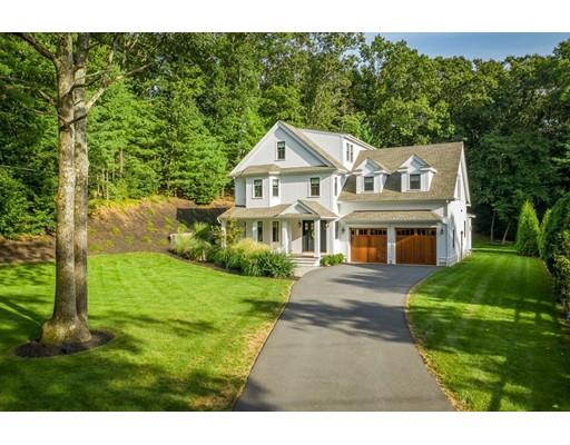 130 Ridge Road Concord, MA 01742 - Photo 25 of 26 a front view of a house with a garden