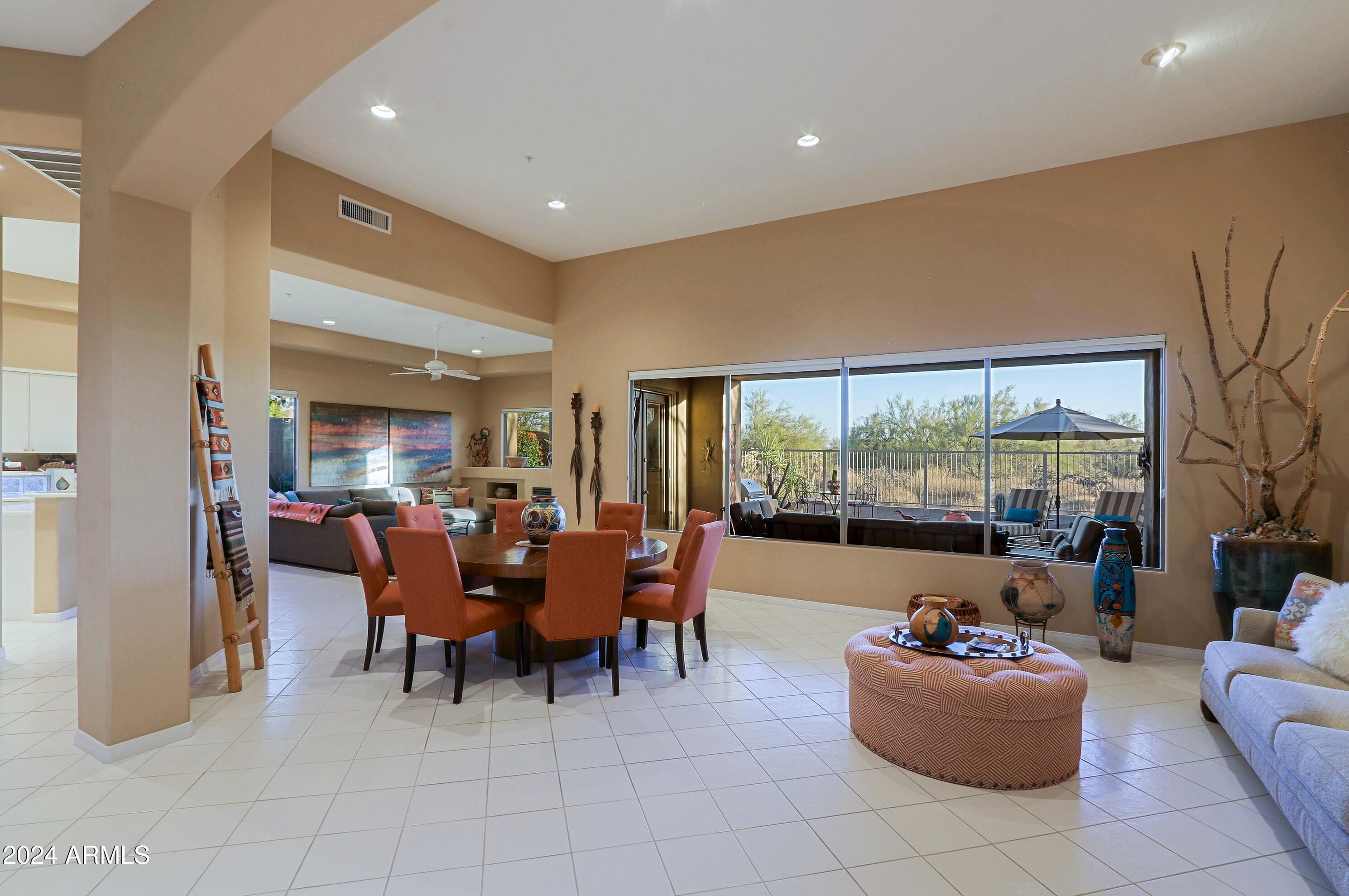 6135 East Evening Glow Drive Scottsdale, AZ 85266 - Photo 13 of 118 a living room with furniture and large windows