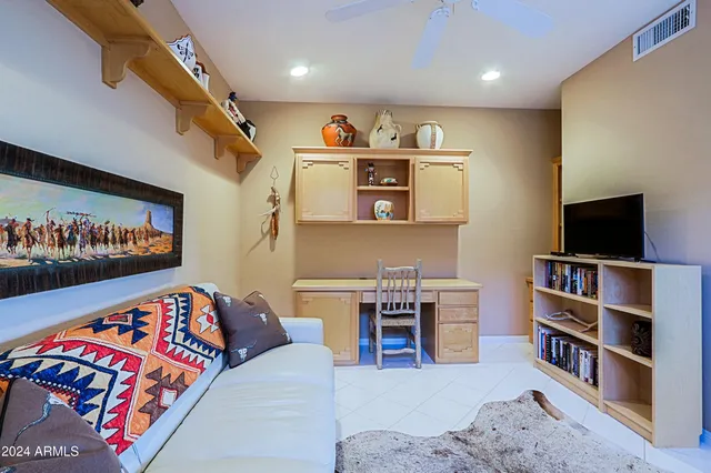 a bedroom with a bed and a mirror