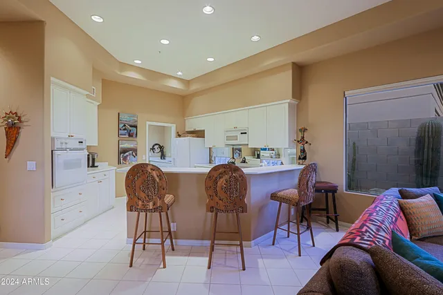 a bedroom with two beds and painted walls