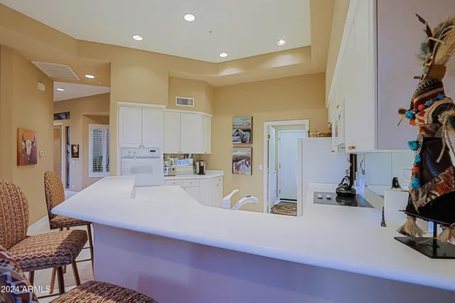 a kitchen with a sink and a refrigerator