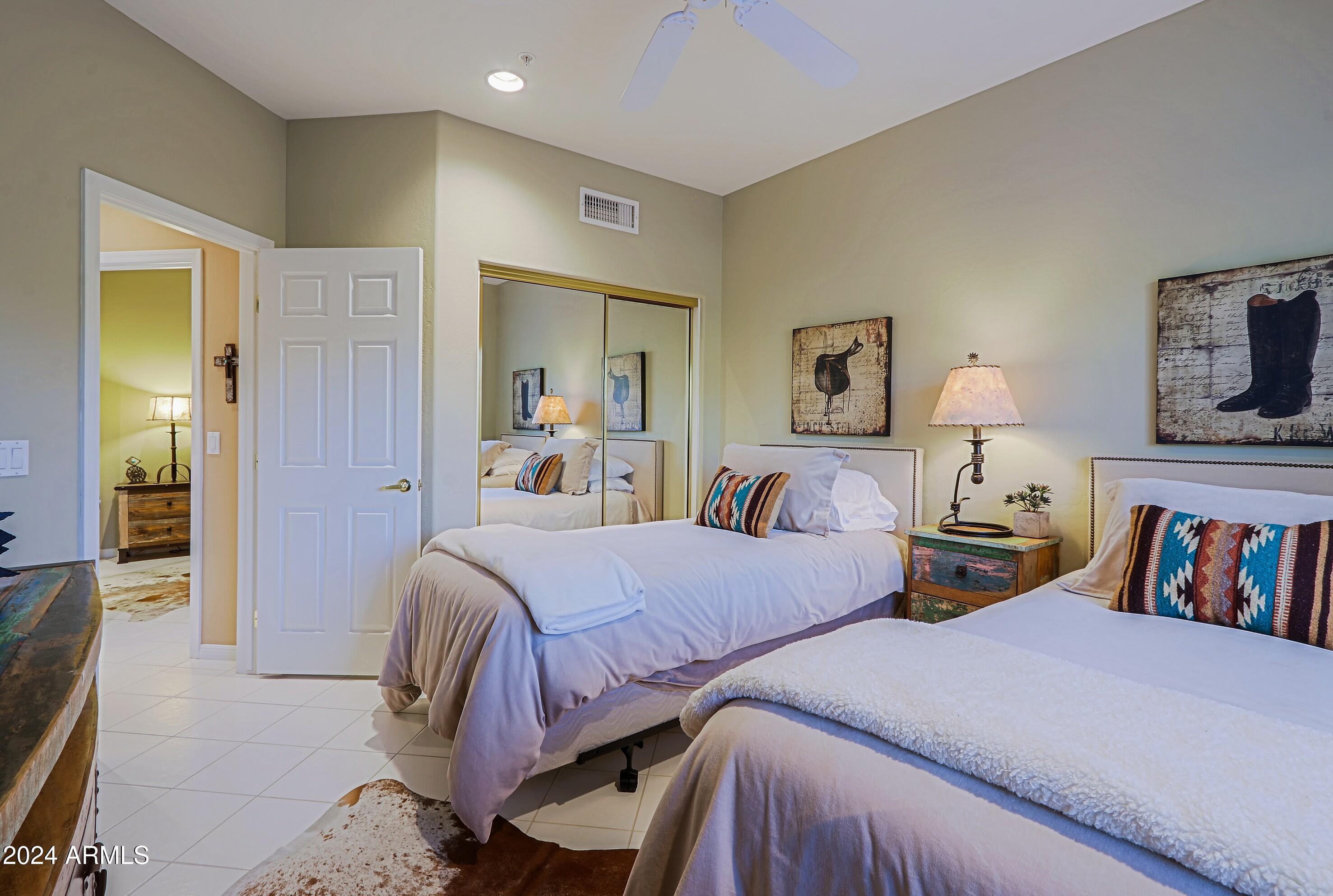 6135 East Evening Glow Drive Scottsdale, AZ 85266 - Photo 49 of 118 a bedroom with two beds and painted walls