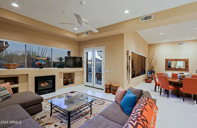 a view of a livingroom with furniture and a flat screen tv