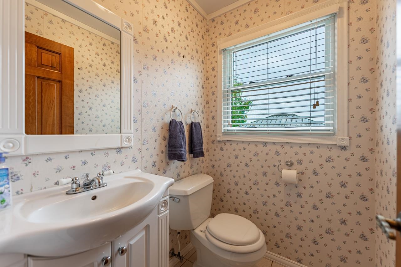 17219 Green Road Harvard, IL 60033 - Photo 16 of 44 a bathroom with a sink a toilet and mirror
