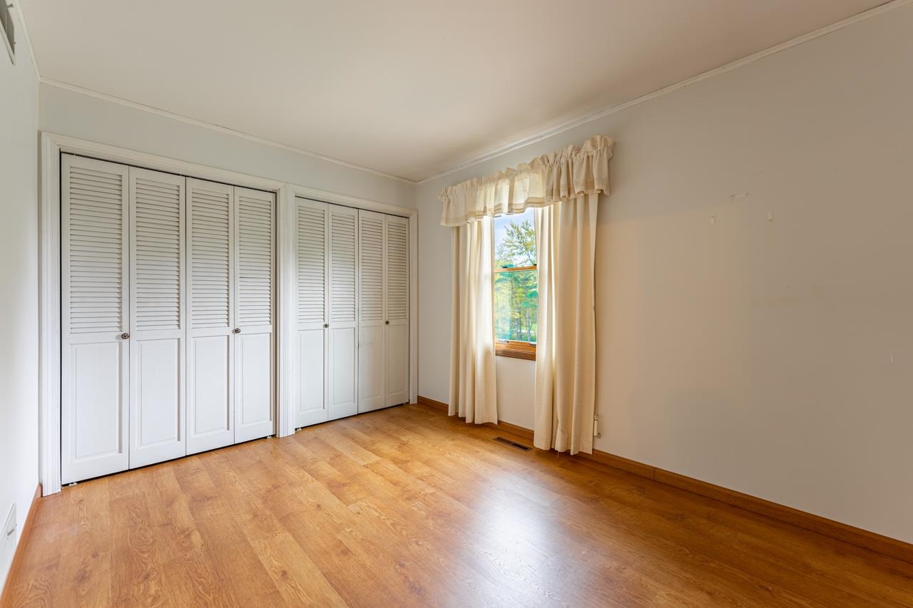 17219 Green Road Harvard, IL 60033 - Photo 24 of 44 a view of an empty room with wooden floor