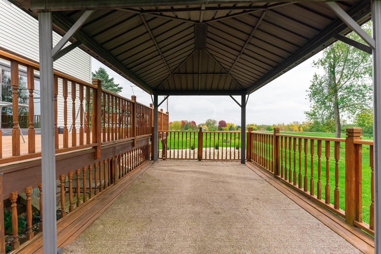 17219 Green Road Harvard, IL 60033 - Photo 35 of 44 a view of a porch with wooden floor