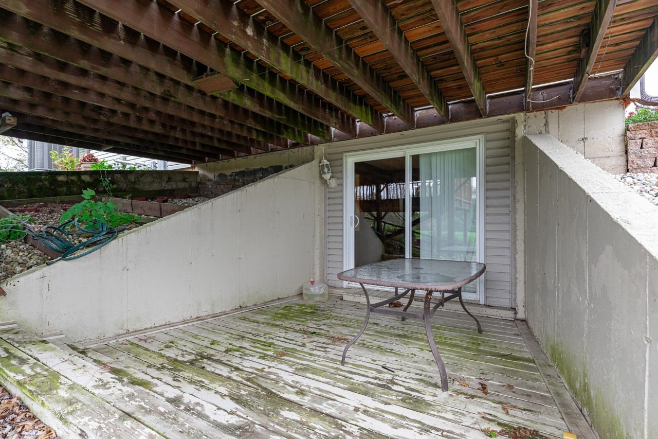 17219 Green Road Harvard, IL 60033 - Photo 39 of 44 a view of a backyard with chair and wooden floor