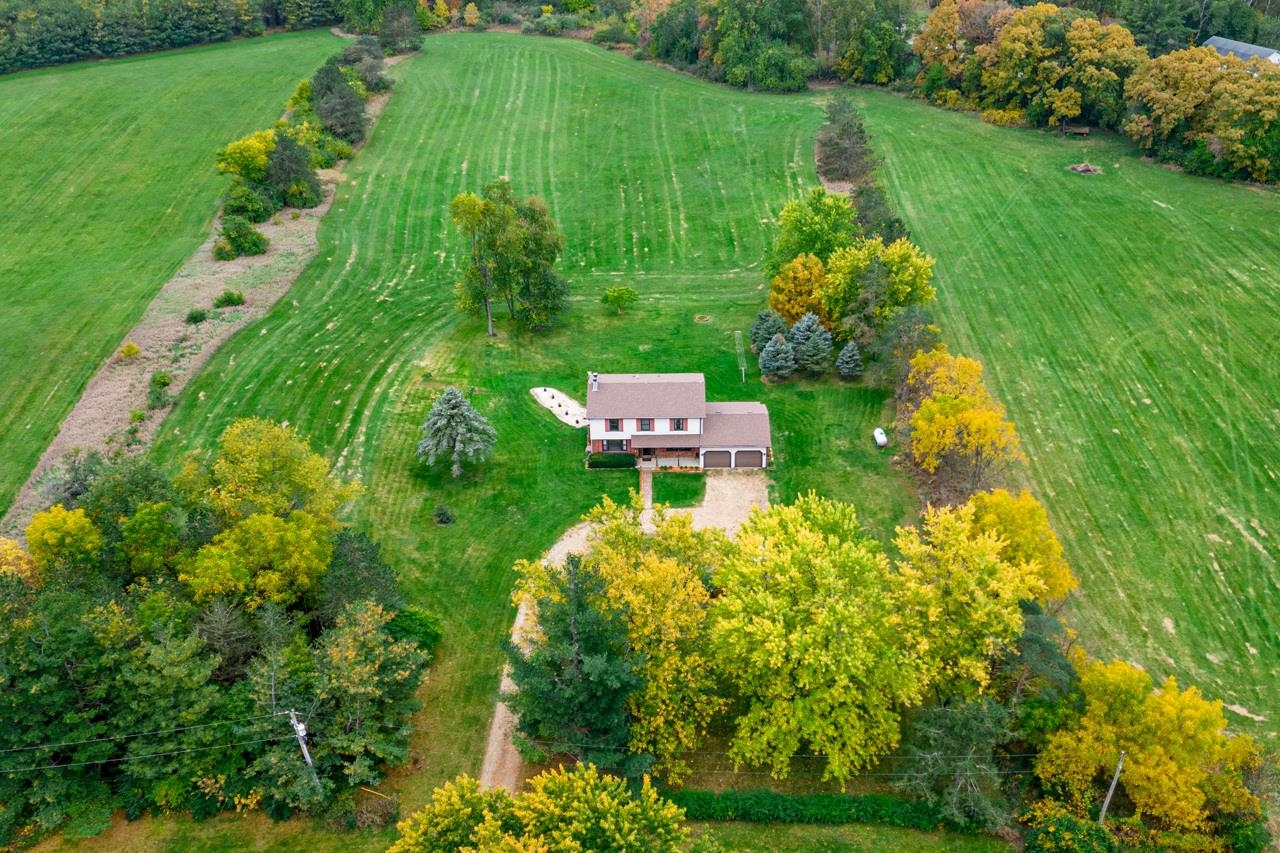 17219 Green Road Harvard, IL 60033 - Photo 4 of 44 a aerial view of a house with a yard
