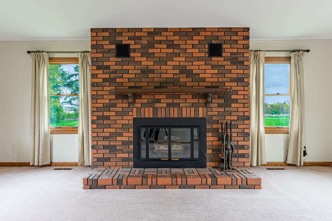 17219 Green Road Harvard, IL 60033 - Photo 9 of 44 a living room with fireplace