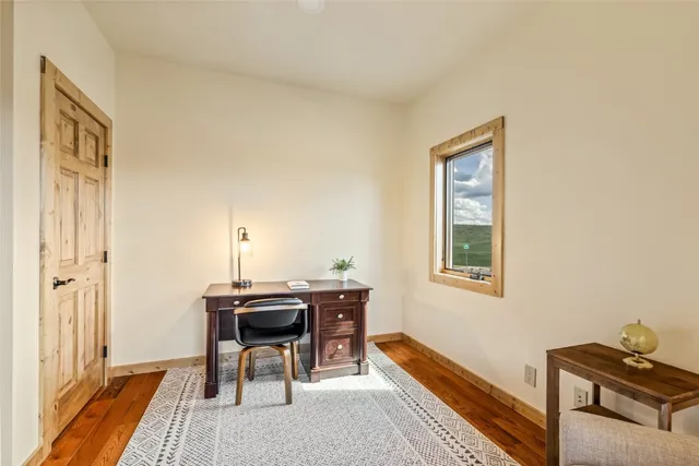 a workspace with furniture and a window