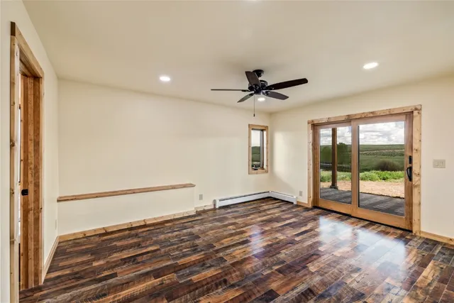 a view of an empty room with glass door