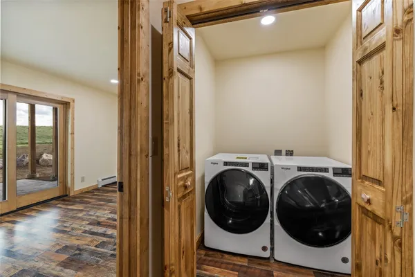 a view of a hallway with washer and dryer
