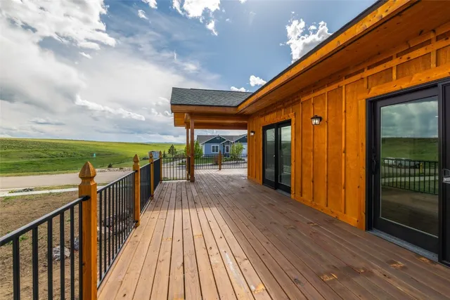 a view of a balcony with wooden floor