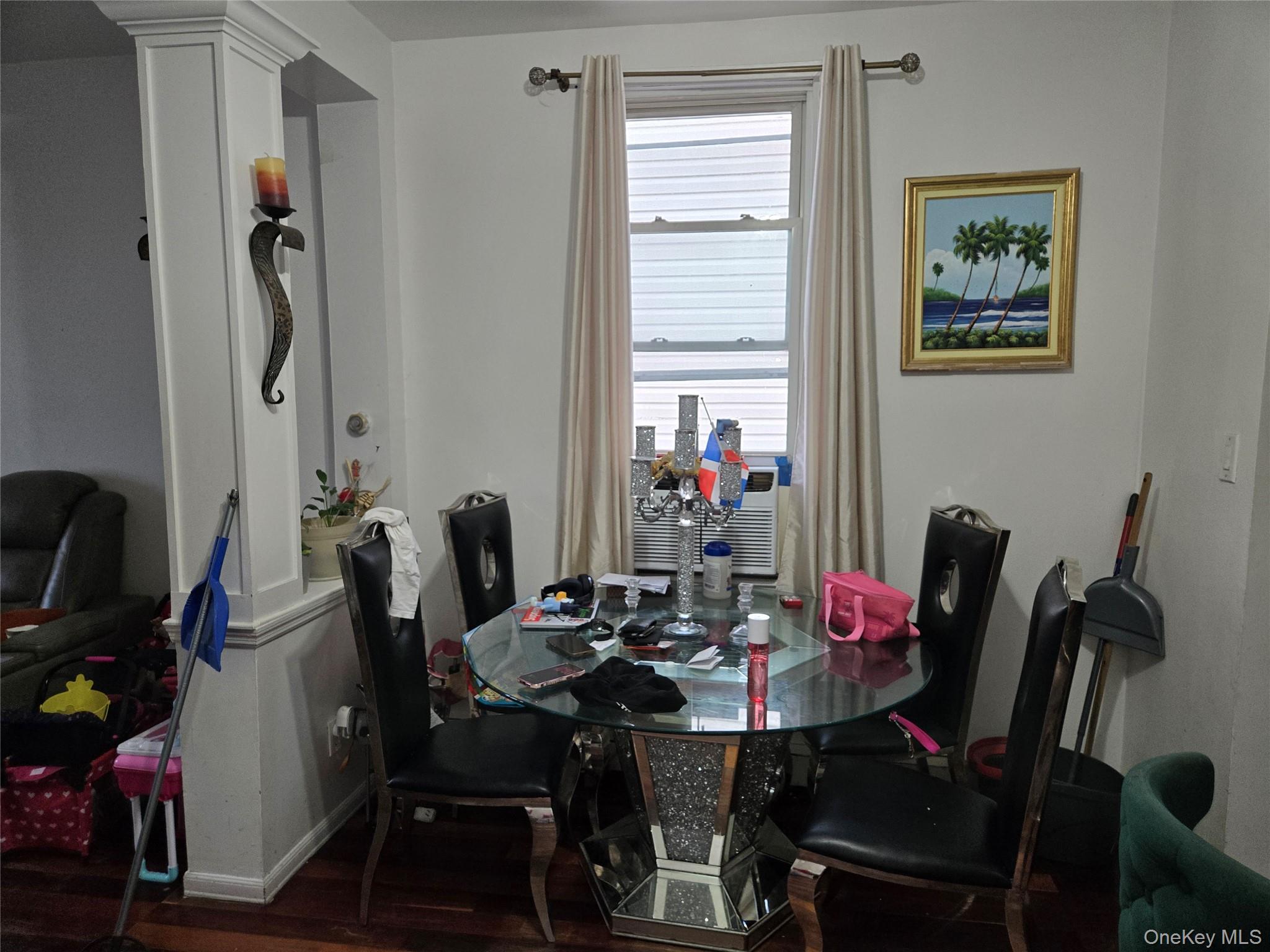 88-30 75th Street Queens, NY 11421 - Photo 17 of 23 a view of a dining room with furniture and a window