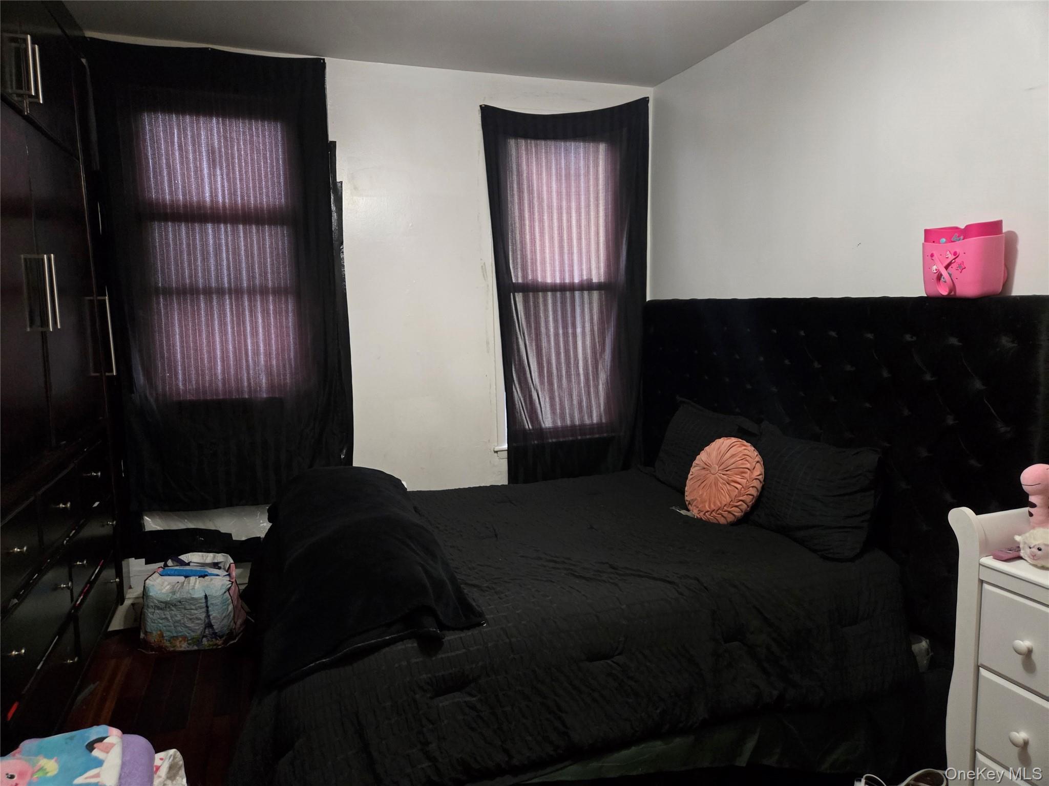 88-30 75th Street Queens, NY 11421 - Photo 22 of 23 a living room with furniture