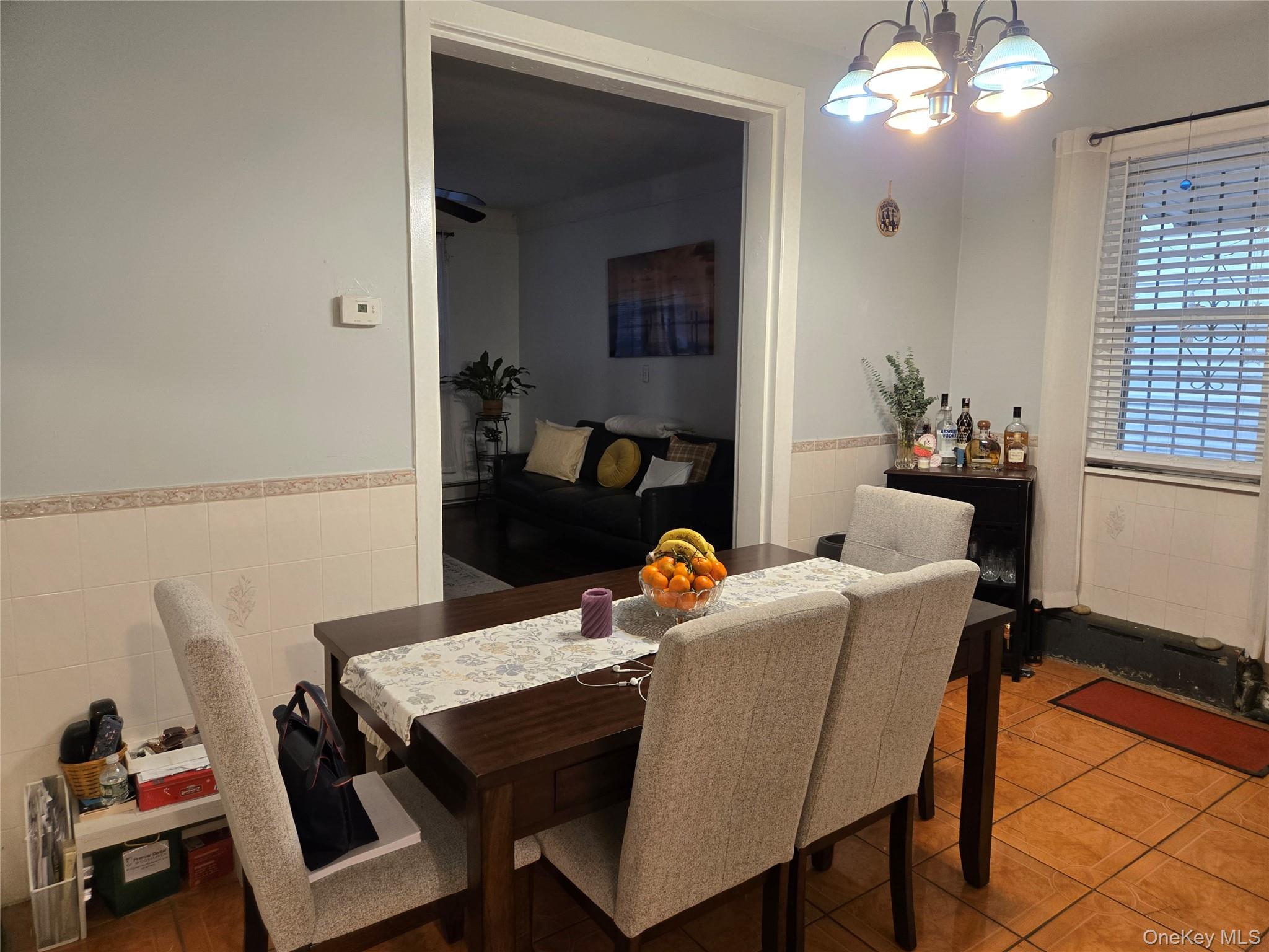 88-30 75th Street Queens, NY 11421 - Photo 5 of 23 a dining room with furniture and window