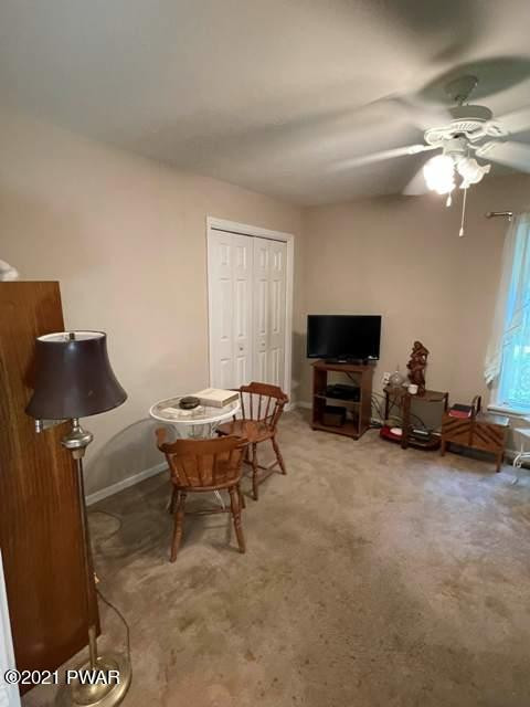 144 Skyview Road Dingmans Ferry, PA 18328 - Photo 7 of 16 a living room with furniture and a flat screen tv