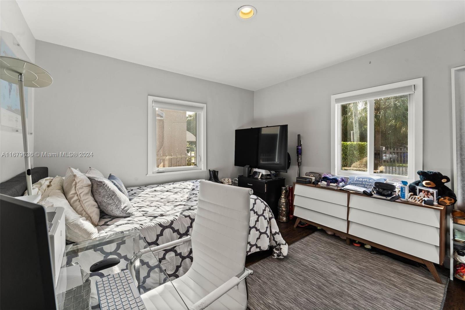 1757 Southwest 24th Terrace Miami, FL 33145 - Photo 11 of 26 a bedroom with furniture and a flat screen tv