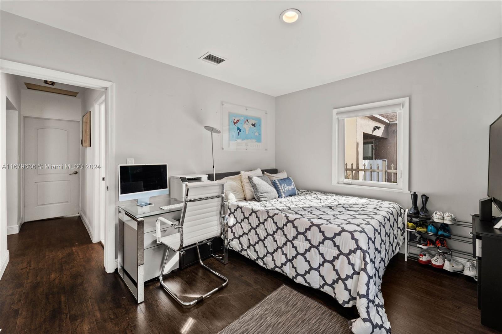 1757 Southwest 24th Terrace Miami, FL 33145 - Photo 12 of 26 a bedroom with a bed and a television