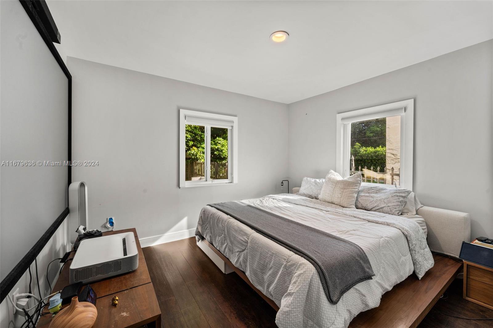 1757 Southwest 24th Terrace Miami, FL 33145 - Photo 13 of 26 a bedroom with a bed and wooden floor