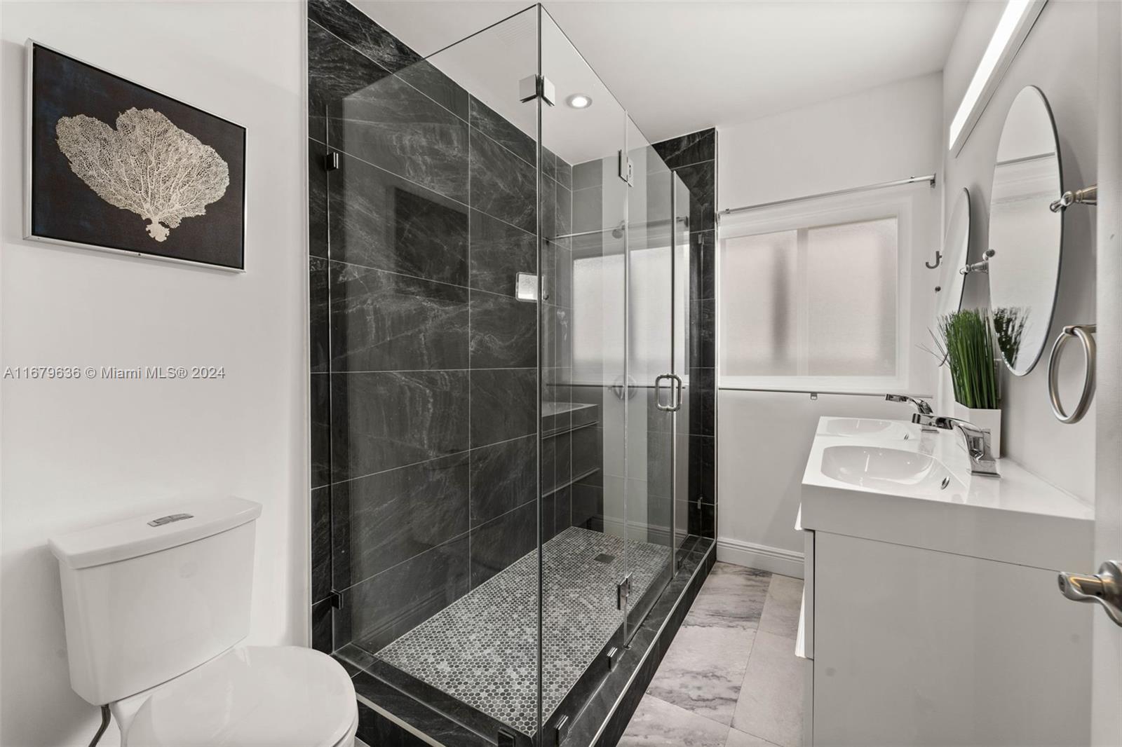 1757 Southwest 24th Terrace Miami, FL 33145 - Photo 14 of 26 a bathroom with a sink toilet and shower