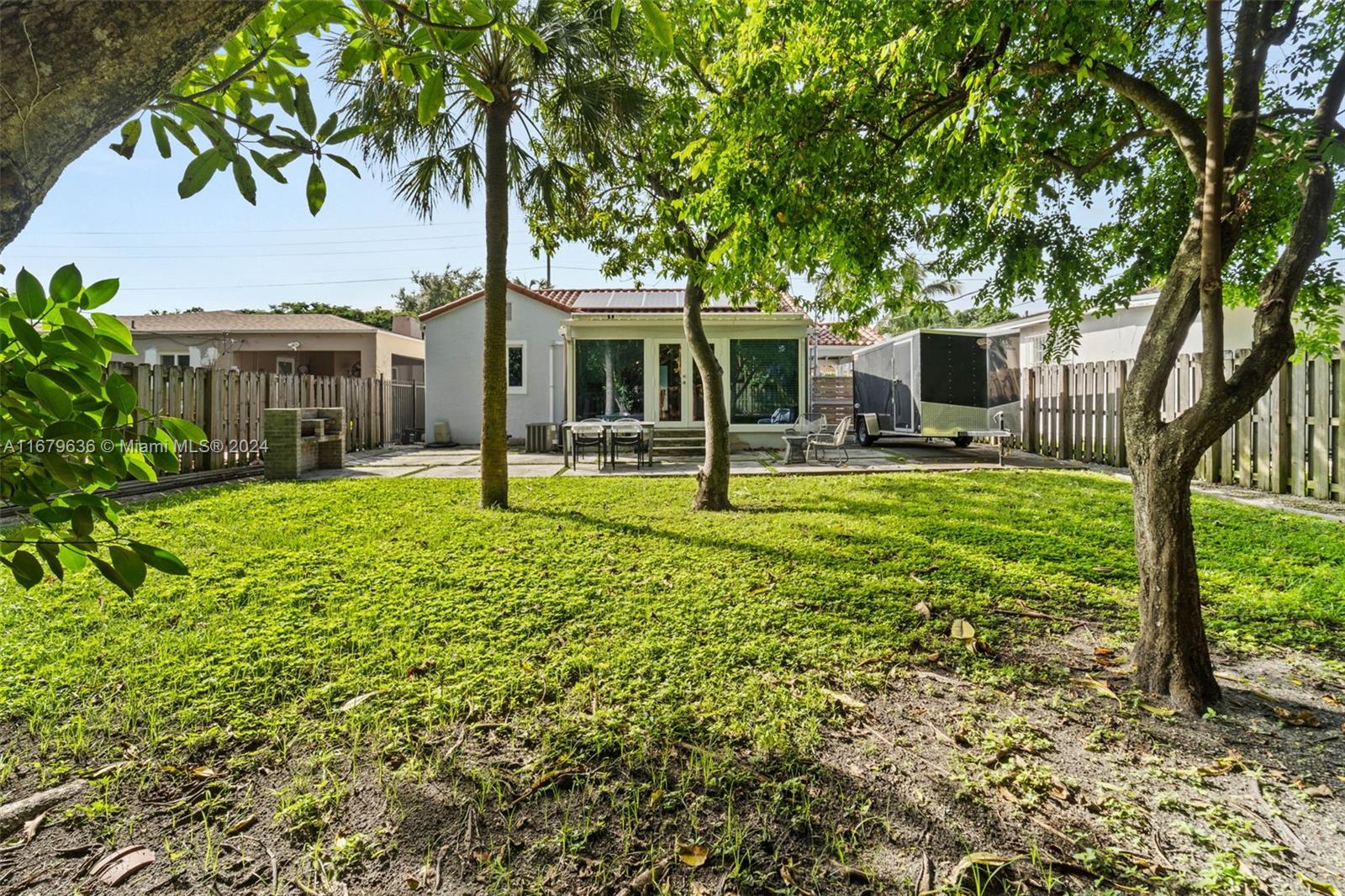 1757 Southwest 24th Terrace Miami, FL 33145 - Photo 17 of 26 a front view of a house with garden