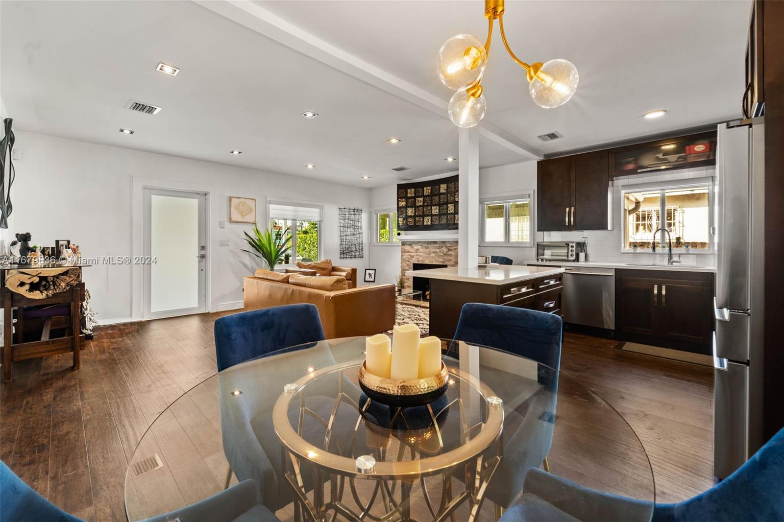 1757 Southwest 24th Terrace Miami, FL 33145 - Photo 2 of 26 a living room with furniture kitchen and a chandelier